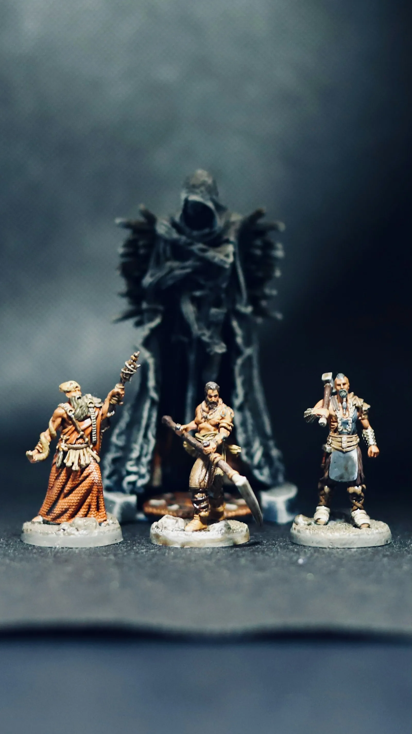 Painted fantasy miniatures standing on finished round bases